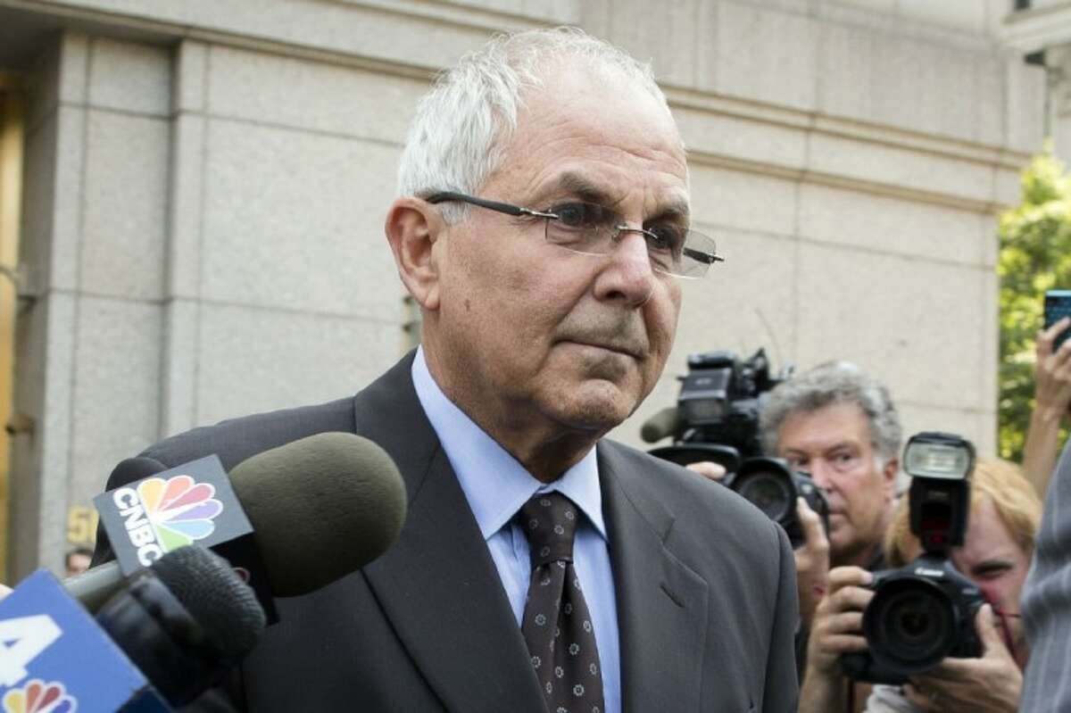 Peter Madoff leaves Federal Court on Friday in New York after pleading guilty to criminal charges.