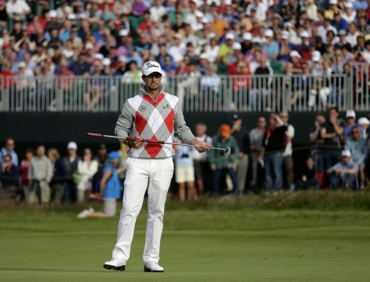 Adam Scott reacts after putting on the 15th green at Royal Lytham & St. Annes during the third round of the British Open on Saturday in Lytham St. Annes, England.