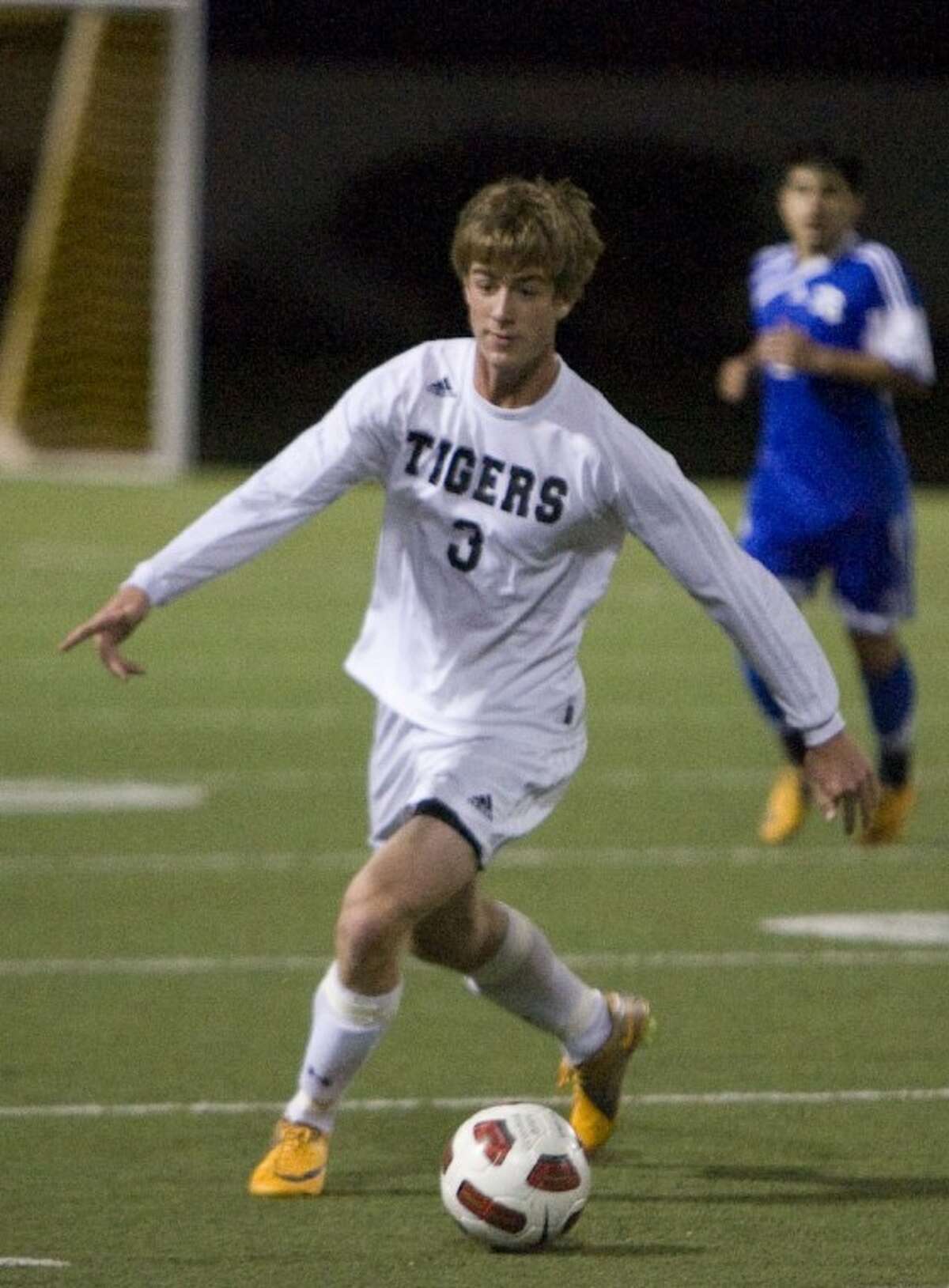Conroe's Jonathan Cutaia dribbles downfield during Tuesday night's game against New Caney at Moorhead Stadium in Conroe.