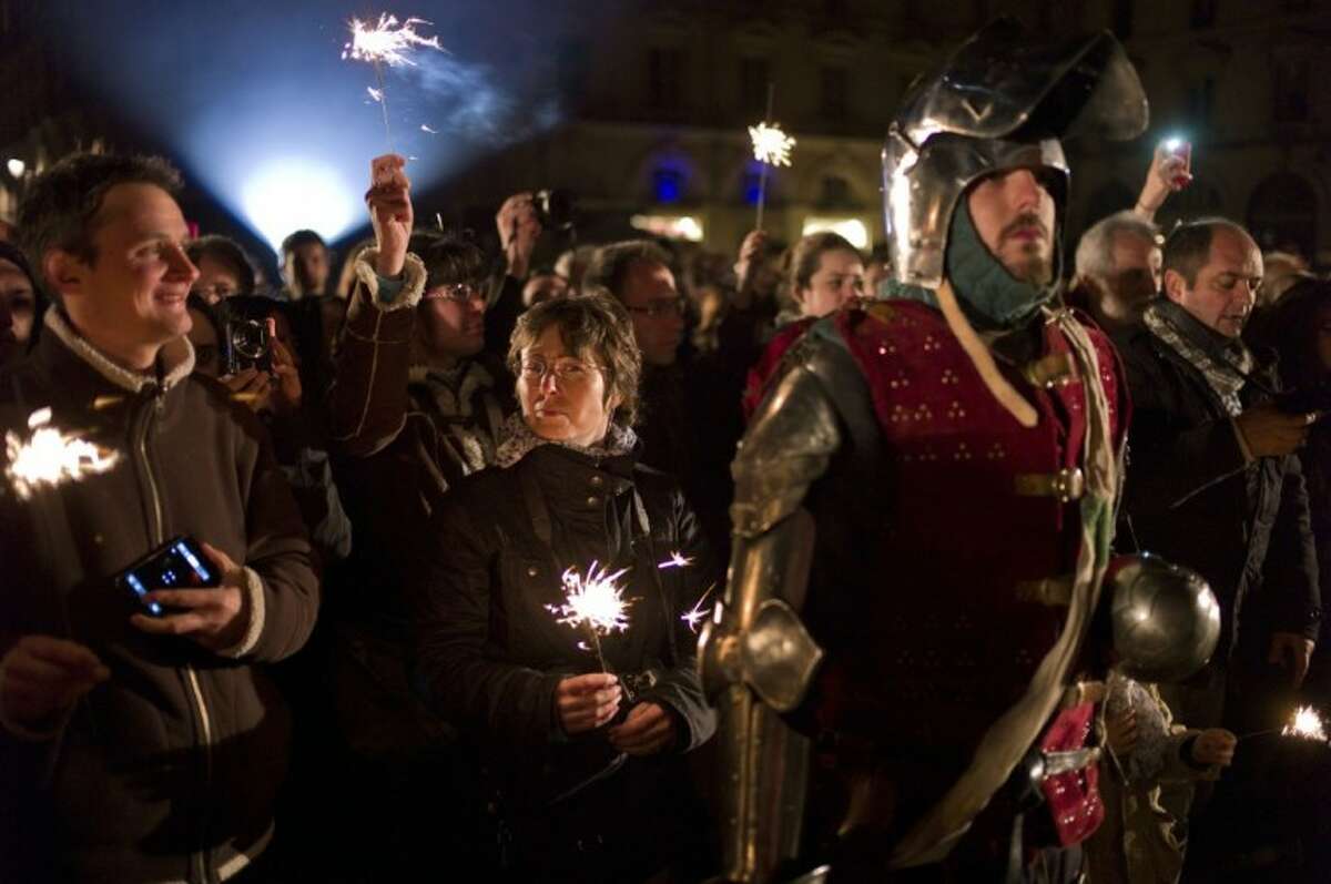 A man dressed like a Middle Age soldier attends ceremonies marking the 600th anniversary of the birth of Joan of Arc, in Orleans, central France, Sunday .