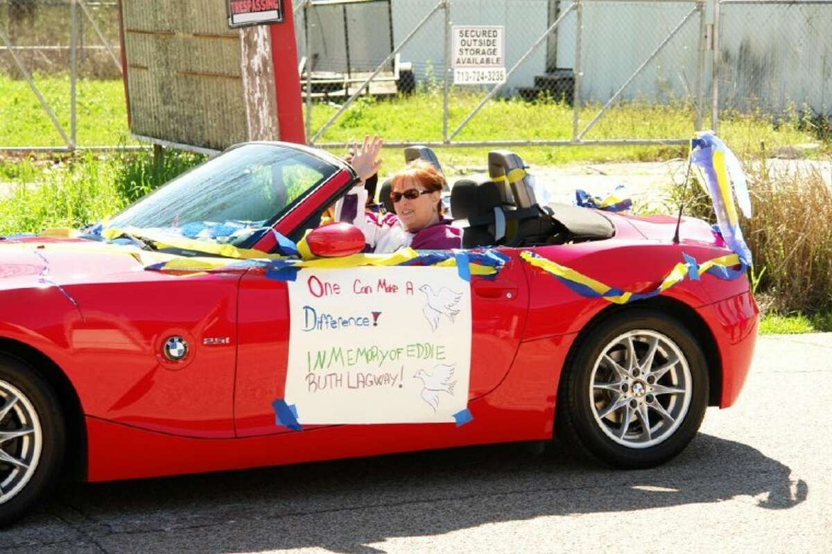 A woman drives a car honoring Eddie Ruth Lagway in Saturday’s Project Hope Black history Parade in Conroe. Lagway, who died on Jan. 12, owned Lagway Bail Bonds and was an active member in the Willis community. She was honored at the parade and at the ceremony afterward.
