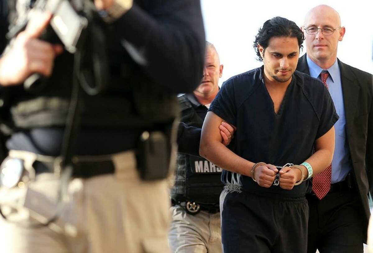 In this Feb. 25, 2011, file photo, Khalid Ali-M Aldawsari is escorted to court in Lubbock, Texas. A jury was selected last Thursday for the trial of the Saudi man who is accused of gathering bomb components with the intention of targeting sites across the United States, including the home of former President George W. Bush.