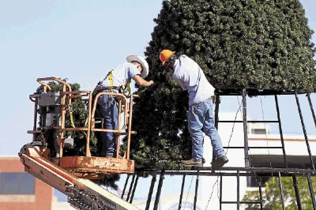City of Conroe works put together Conroe’s Christmas tree at the corner of Texas 105 and Frazier Street. The tree will be lit on Nov. 26 at 6:30 p.m.