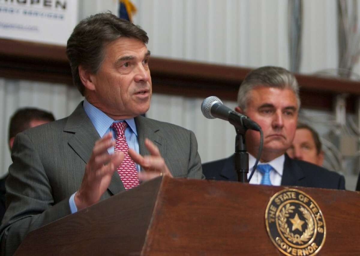 Texas Gov. Rick Perry addresses the media Wednesday as he speaks at Thigpen Energy in Cut and Shoot. Perry spoke regarding proposed reforms to welfare and unemployment insurance programs.