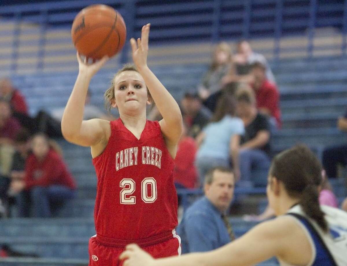 Caney Creek's Jessica Twardowski shoots a basket during the game against New Caney Friday at New Caney High School. See more photos online at www.yourconroenews.com/photos.