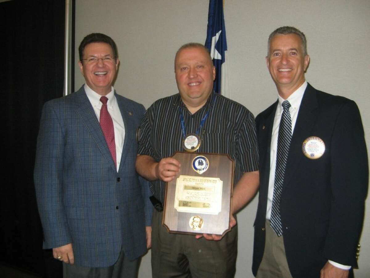 The Conroe Noon Lions Club honored Lion Wayne Mack, center, with the prestigious Jack Weich Award from the Texas Lions Camp in Kerrville for his dedication and support of the camp and it’s “can do” motto. Making the presentation was Past District Governor Glen Starr, left, and Club President Rich Sproba.