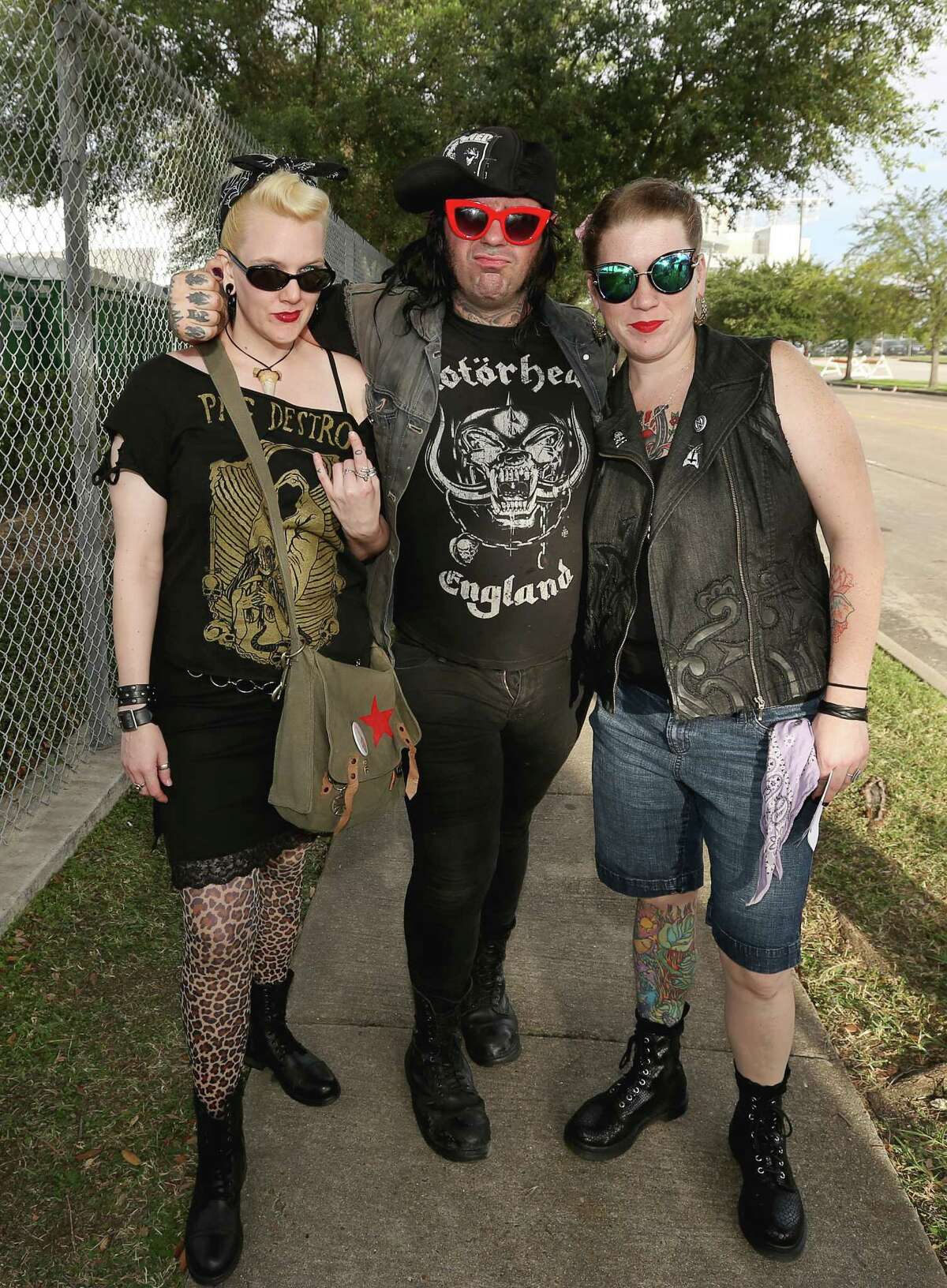 Hard rock and metal fans pose for a photo at Houston Open Air Festival at the NRG Park complex Saturday, Sept. 24, 2016, in Houston.