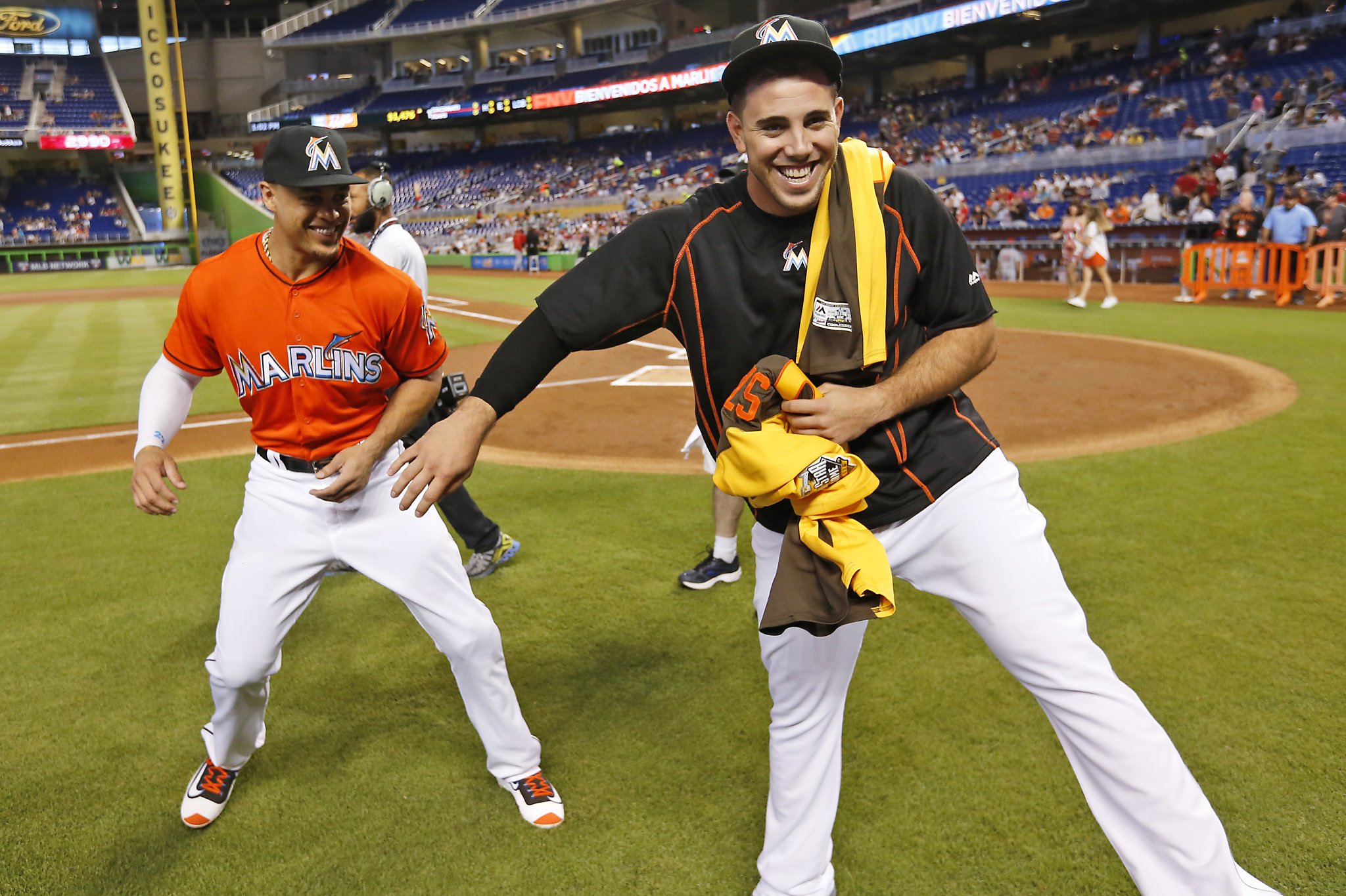 Miami Marlins starting pitcher Jose Fernandez, left, smiles at