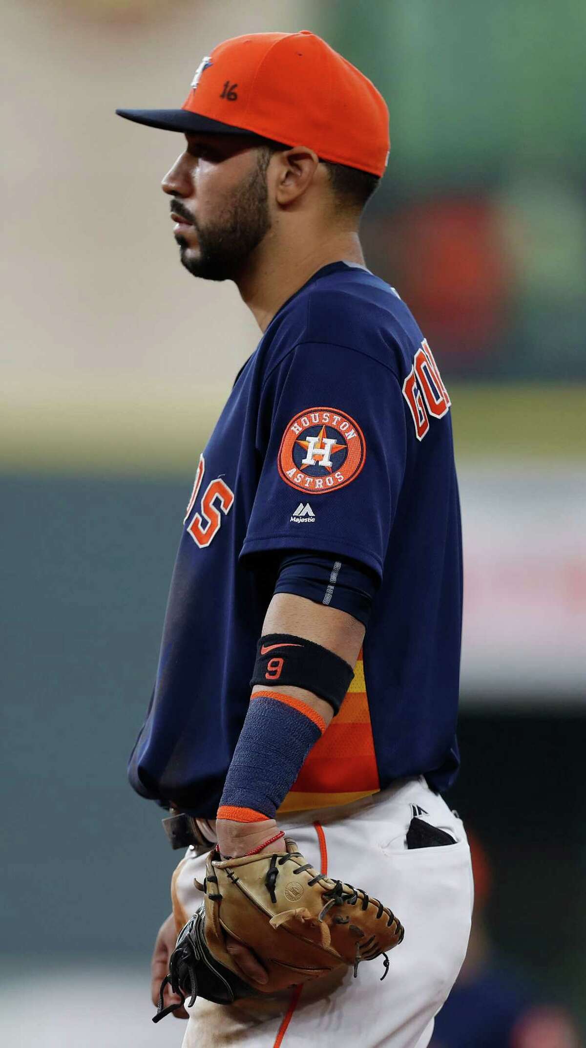 Houston Astros first baseman Marwin Gonzalez (9) wears his baseball cap with "16" written on it in honor of Marlin's Jose Fernandez, who was killed in an overnight boating accident, during the fourth inning of an MLB game at Minute Maid Park, Sunday, Sept. 25, 2016 in Houston.