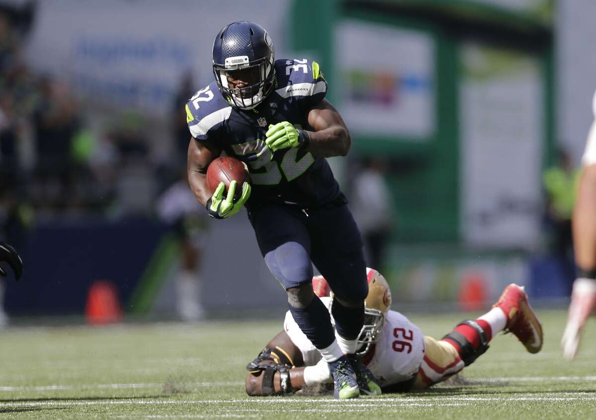 Seattle Seahawks' Christine Michael carries against the San Francisco 49ers in the first half of an NFL football game, Sunday, Sept. 25, 2016, in Seattle. (AP Photo/John Froschauer)
