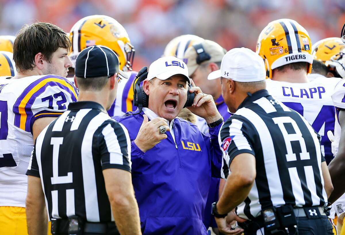 FILE - This Sept. 24, 2016 file photo shows LSU head coach Les Miles reacting to a call during the first half of an NCAA college football game against Auburn in Auburn, Ala. Two people familiar with the decision say LSU has fired Miles and offensive coordinator Cam Cameron and promoted defensive line coach Ed Orgeron to interim head coach. The person spoke to The Associated Press on Sunday, Sept. 25, 2016 on condition of anonymity because no announcement has been made. Miles firing comes one day after LSU lost 18-13 at Auburn. (AP Photo/Butch Dill, file)