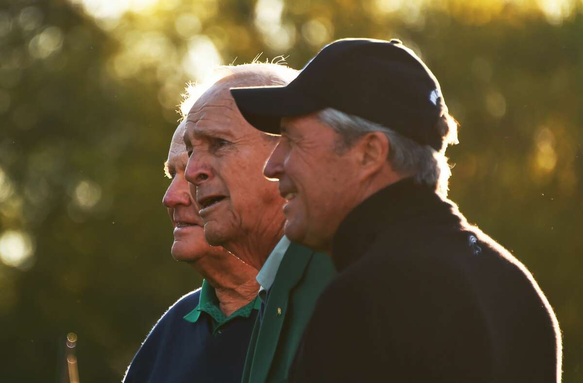 (L-R) Honorary starters US golfers Jack Nicklaus, Arnold Palmer and South Africa's Gary Player arrive to begin Round 1 of the 80th Masters Golf Tournament at the Augusta National Golf Club on April 7, 2016, in Augusta, Georgia.