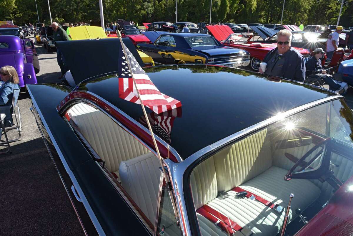 Car enthusiasts check out cars at the 6th annual Times Union Hope Fund Car & Motorcycle Show in the Times Union parking lot on Sunday, Sept. 25, 2016 in Colonie, N.Y. (Lori Van Buren / Times Union)