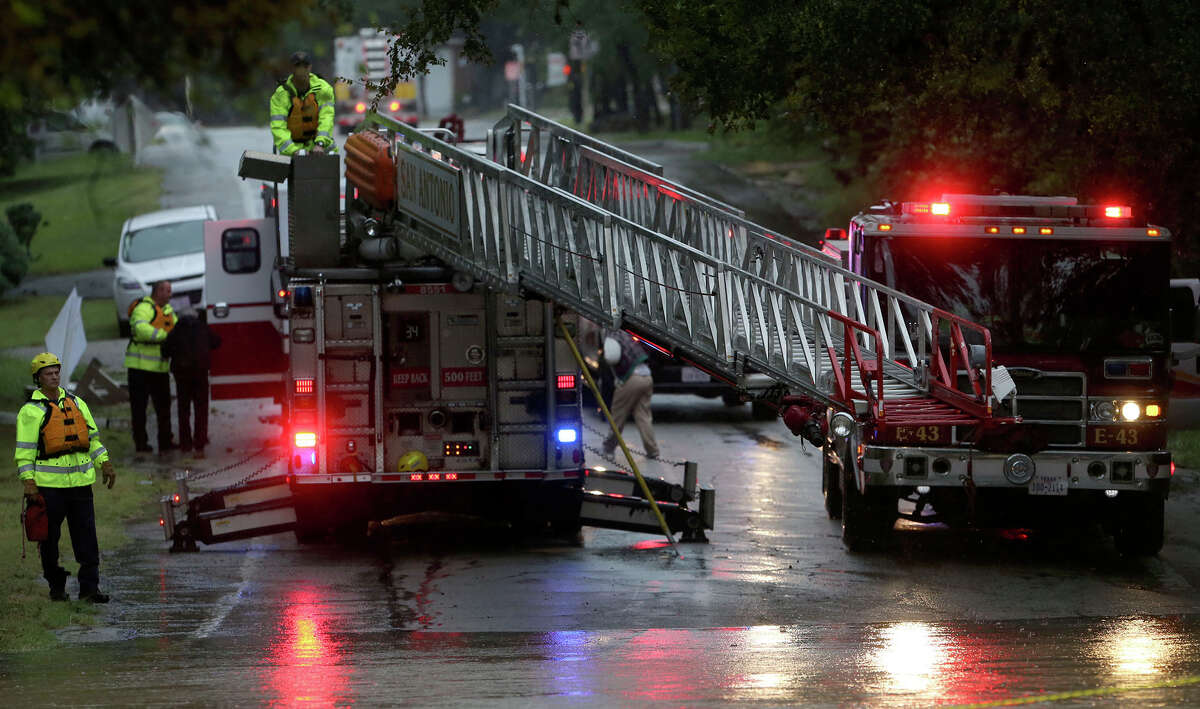 Photos: Firefighters rescue 'special-needs' passengers from flooding ...