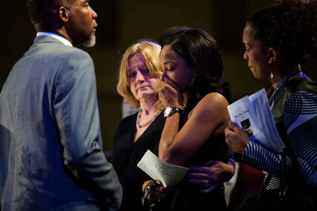 Wanika Wade, the widow of Melvin Mckinney, sobs as she views her husband's casket during his funeral at True Vision Church on August 2, 2016. McKinney was the last of four prisoners who committed suicide in the Bexar County Jail.