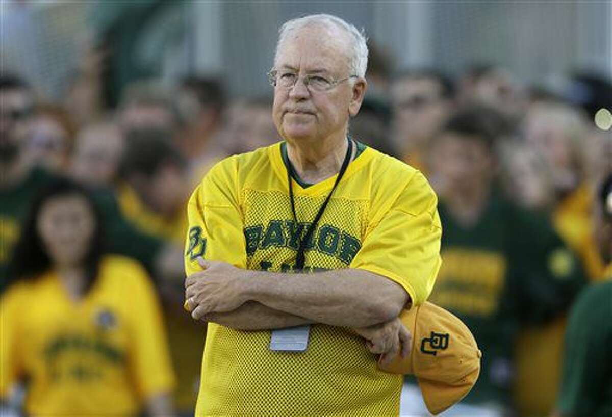 FILE - In the Sept. 12, 2015, file photo, Baylor President Ken Starr waits to run onto the field before an NCAA college football game in Waco, Texas. Baylor University's board of regents says it will fire football coach Art Briles and re-assign Starr in response to questions about its handling of sexual assault complaints against players. The university said in a statement Thursday, May 26, 2016, that it had suspended Briles "with intent to terminate." Starr will leave the position of president on May 31, but the school says he will serve as chancellor. (AP Photo/LM Otero, File)