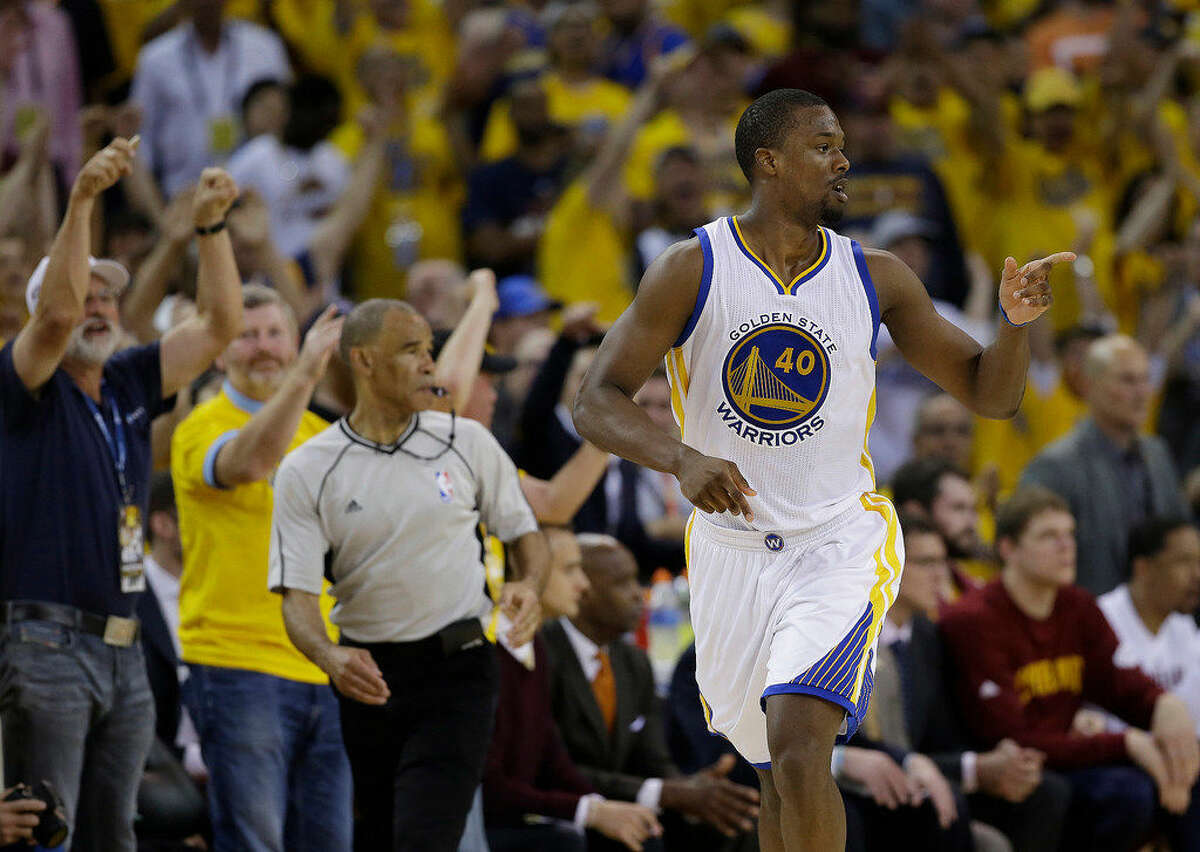 Golden State Warriors forward Harrison Barnes (40) gestures after scoring against the Cleveland Cavaliers during the second half of Game 7 of basketball's NBA Finals in Oakland, Calif., Sunday, June 19, 2016. (AP Photo/Marcio Jose Sanchez)