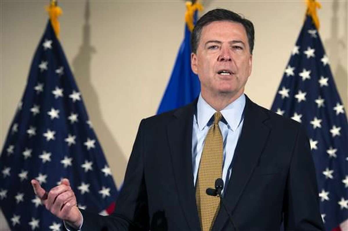 FBI Director James Comey makes a statement at FBI Headquarters in Washington, Tuesday, July 5, 2016. Comey said 110 emails sent or received on Hillary Clinton's server contained classified information. (AP Photo/Cliff Owen)  
