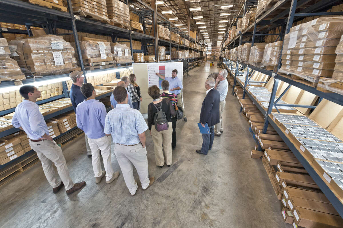 Harry Rowe presents X-ray fluorescence technology to industry representatives in this undated photo inside the University of Texas' oil well core sample warehouse.