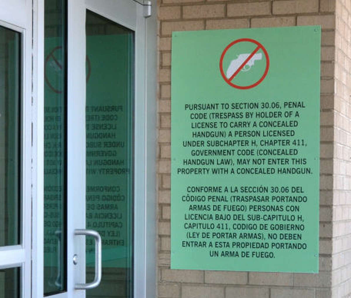A sign posted outside Midland Park Mall bans a person from entering the property with a concealed handgun, even if the person has a lawfully issued permit to carry a concealed handgun. The signage is legal under section 30.06 of Texas Penal Code which grants property owners the right to ban concealed permit holders from entering. James Durbin/Reporter-Telegram
