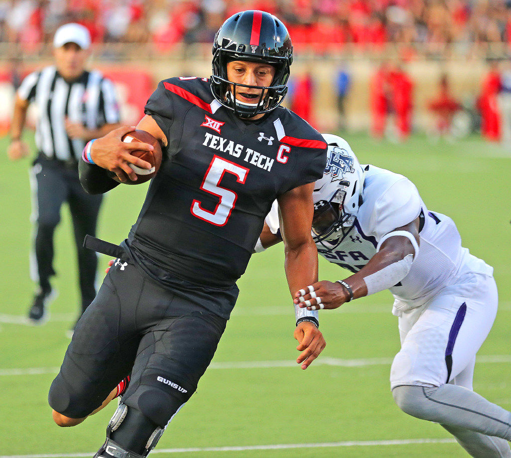 Patrick Mahomes Texas Tech Red Raiders Unsigned Black Jersey Throwing Close Up Photograph