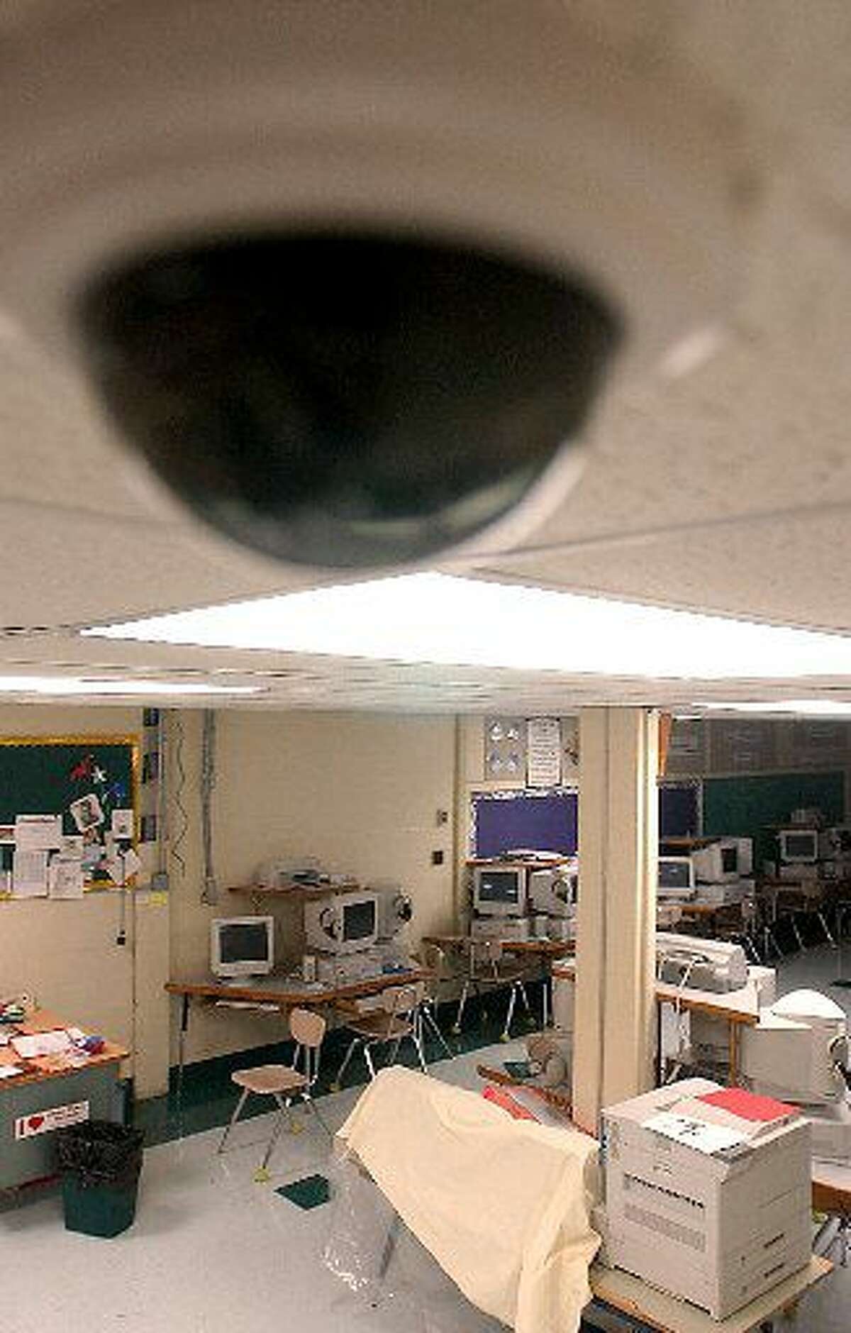 FILE-- With the start of the school year, students at all Biloxi, Miss. schools will have cameras in the room and halls of the schools. The computer lab at Beauvoir Elementary School in Biloxi, seen Tuesday, Aug. 12, 2003, has two cameras to monitor the schoolroom. Beginning this school year, Senate Bill 507 requires Texas school districts to install, operate and maintain video cameras and video-audio recording equipment in some special education classrooms if a parent, trustee or staff member requests it. (AP Photo/The Sun Herald, Tim Isbell)