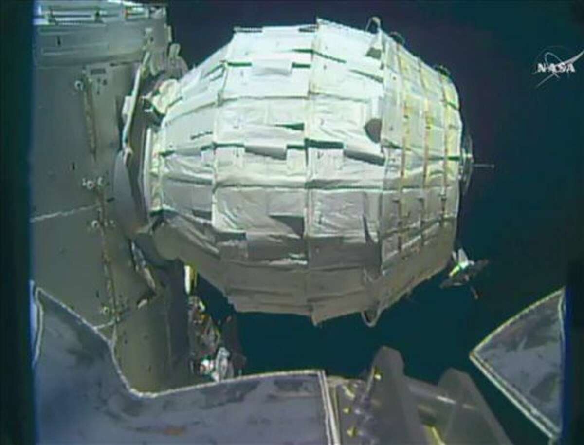 FILE - This Saturday, May 28, 2016 file image made from video provided by NASA shows the inflation of a new experimental room at the International Space Station. The crew of the International Space Station entered the newly expanded pod Monday, June 6, 2016, to collect air samples. As is customary, they wore goggles and cloth masks in case of floating debris. Williams says the room _ the Bigelow Expandable Activity Module, or BEAM _ is pristine but cold. The chamber arrived in April and was inflated a week ago. (NASA via AP)(NASA via AP, File)