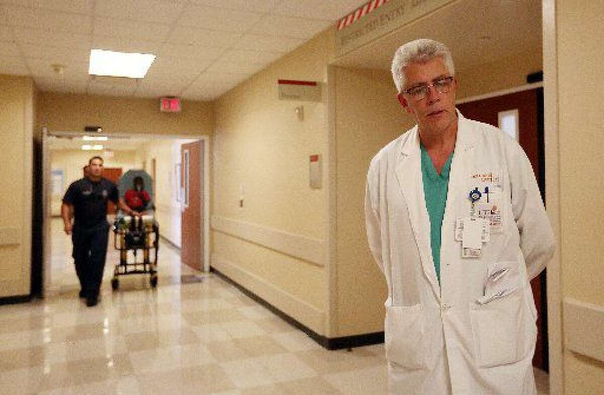 Dr. John Holcomb, Director of the Texas Trauma Institute at Memorial-Hermann, walks through trauma center on Tuesday, July 7, 2015, in Houston. ( Mayra Beltran / Houston Chronicle )