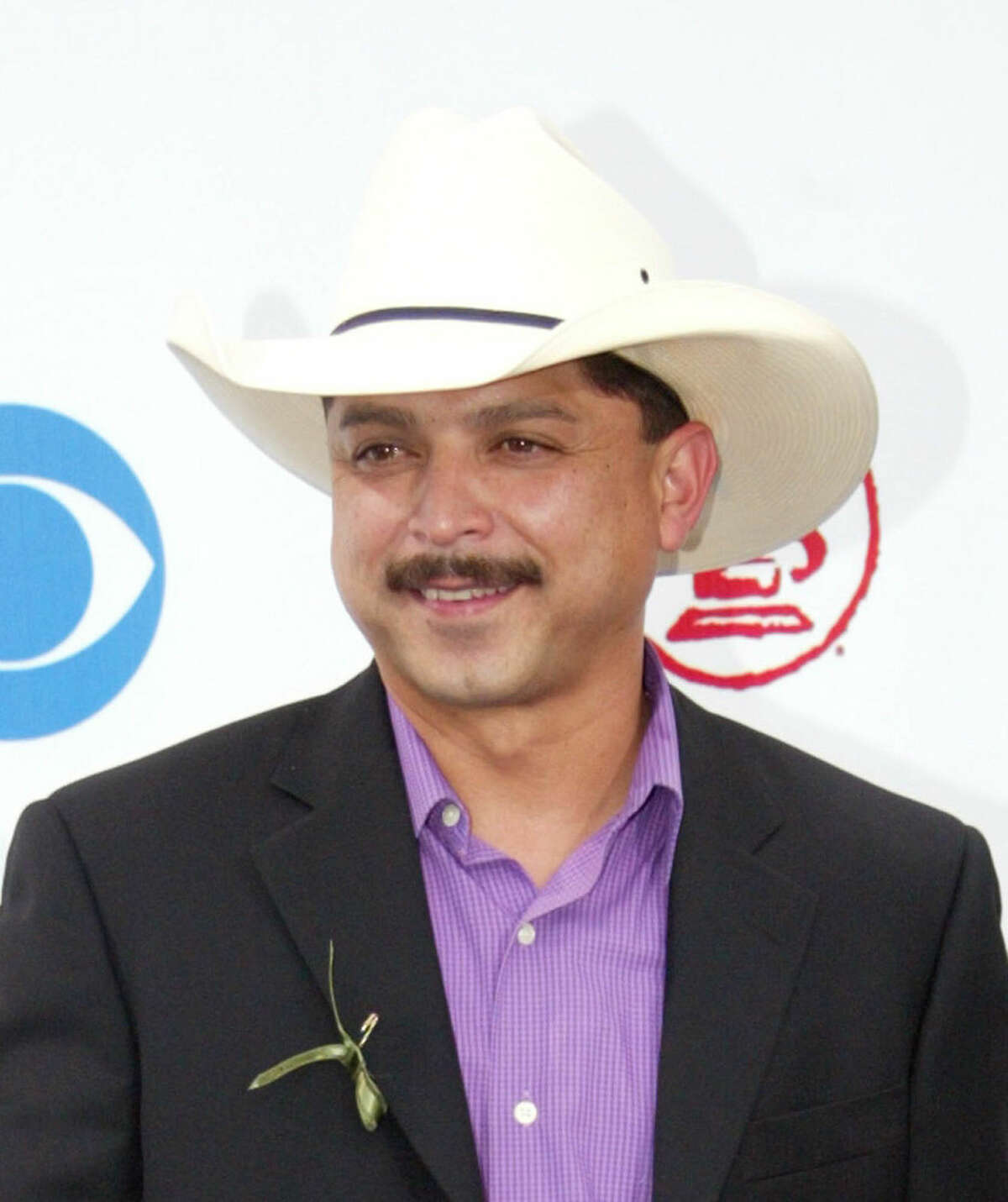In this Sept. 3, 2003 file photo, Emilio Navaira arrives at the Latin Grammy Awards in Miami. The Grammy-winning Tejano star has died in New Braunfels, Texas. He was 53. Police in New Braunfels said in a statement Tuesday, May 17, 2016, that preliminary results indicate the entertainer died of natural causes. (AP Photo/Wilfredo Lee, file)