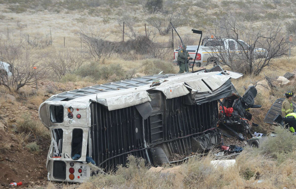FILE: he transport bus went over the bridge at Mile Marker 103 on I-20, drove off the bridge and landed on train tracks when the bus was struck by a train. ( Odessa American)