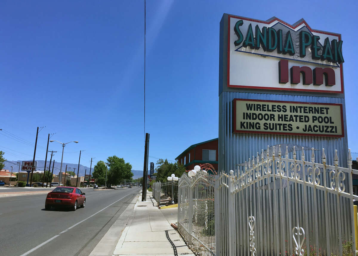 This Wednesday, July 13, 2016 photo shows the Sandia Peak Inn in Albuquerque, N.M., one of many motels along the historic Route 66 installing charging stations for electric cars. Route 66, a highway made famous for attracting gas-guzzling Chevrolet Bel Airs traveling from Chicago to Los Angeles, is seeing a growing number of electric car charging stations along the 2,500-mile path, and some states even are pushing for solar panels and electric buses. (AP Photo/Russell Contreras)