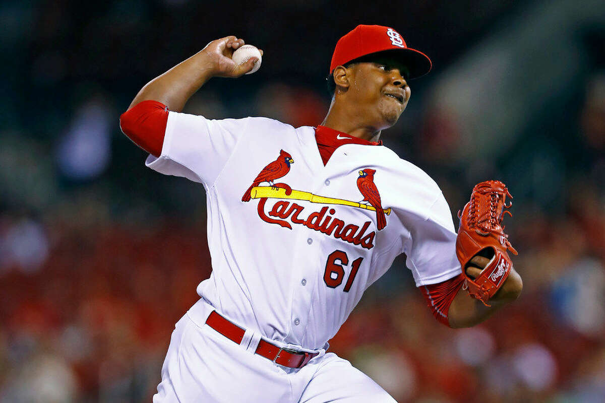 St. Louis Cardinals pitcher Alex Reyes, making his major league debut, throws during a baseball game against the Cincinnati Reds, Tuesday, Aug. 9, 2016, in St. Louis. The Reds won 7-4. (AP Photo/Billy Hurst)