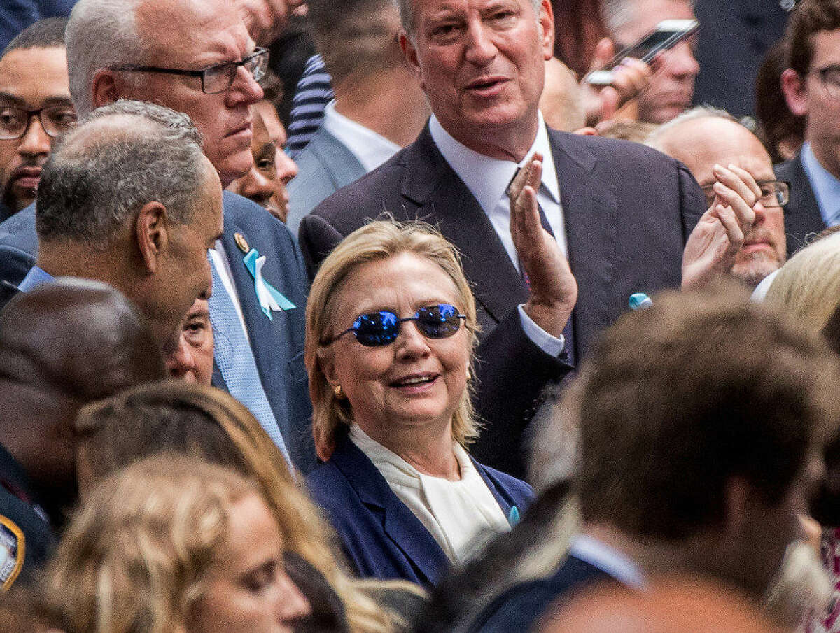 Democratic presidential candidate Hillary Clinton abruptly left the ceremony at the Sept. 11 memorial, in New York, Sunday, Sept. 11, 2016. Her physician said the incident was related to pneumonia and dehydration