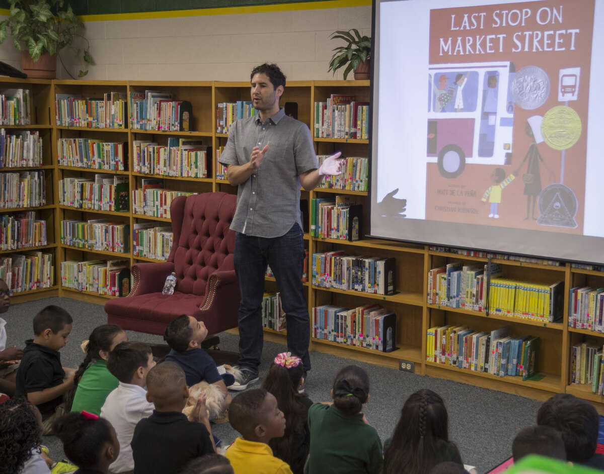Author Matt De La Pena reads his book, Last Stop on Market Street, and talks about the story Monday 09-12-16 to Milam Elementary first graders as part of Project Literacy. Tim Fischer/Reporter-Telegram