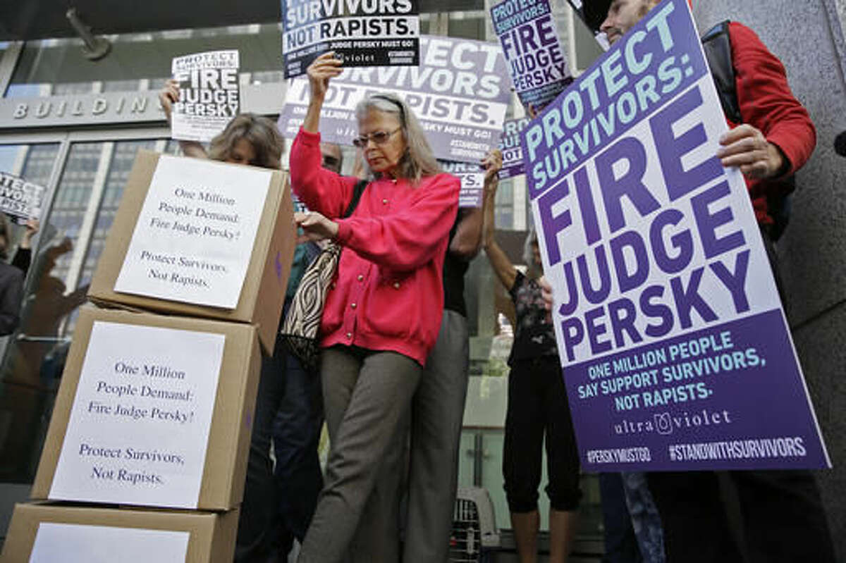 Activists from UltraViolet, a national women's advocacy organization, hold a rally before delivering over one million signatures to the California Commission on Judicial Performance calling for the removal of Judge Aaron Persky from the bench Friday, June 10, 2016, in San Francisco. A group of California lawmakers joined women's rights advocates Friday in urging a California agency to take action against the judge who sentenced a former Stanford University swimmer to six months in jail for sexually assaulting an unconscious woman. (AP Photo/Eric Risberg)