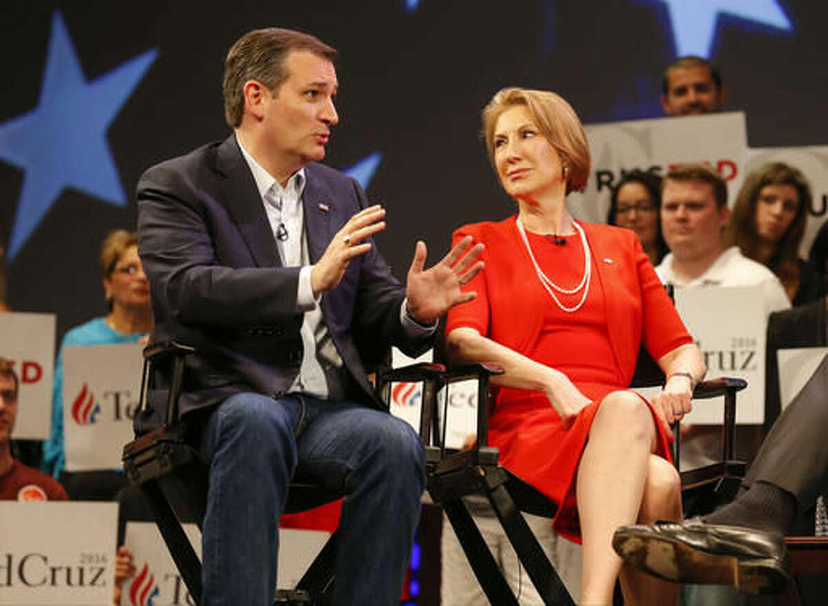 In this photo taken March 11, 2016, Republican presidential candidate, Sen. Ted Cruz, R-Texas speaks to Carly Fiorina in Orlando, Fla., Friday, March 11, 2016. According to an AP Source: Cruz has picked Fiorina as his running mate (AP Photo/Mike Carlson)