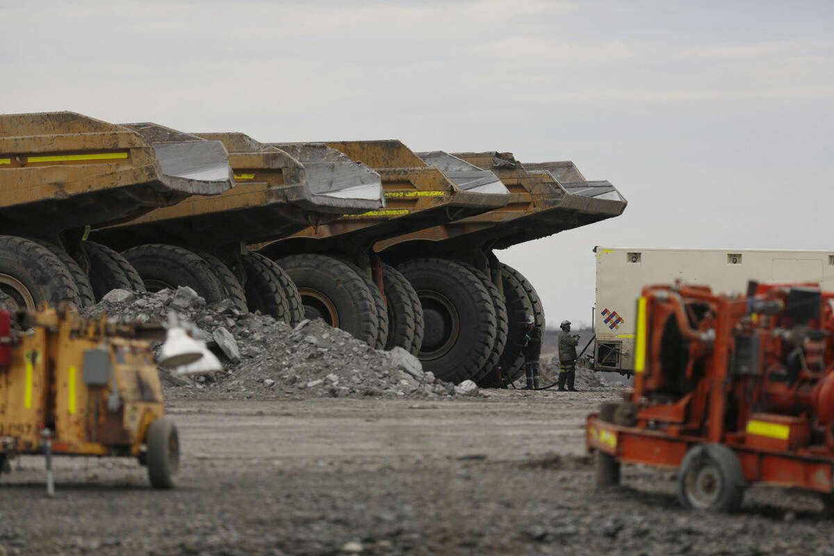 Workers refuel dump trucks at the Peabody Energy Corp. Somerville Central coal mine in Oakland City, Indiana, U.S., on Wednesday, April 6, 2016. Peabody filed for bankruptcy on Wednesday, the most powerful convulsion yet in an industry that's still waiting for the coal market to bottom out. Photographer: Luke Sharrett/Bloomberg