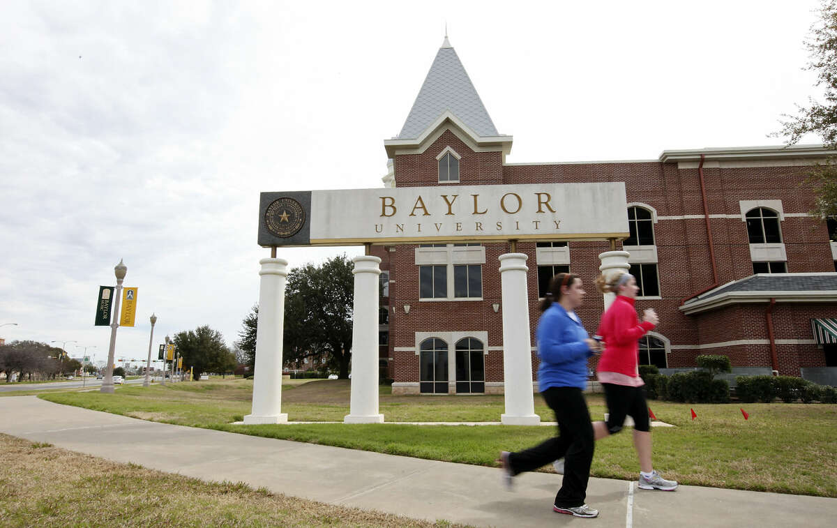 FOR METRO - Students jog around the Baylor University campus Sunday Feb. 12, 2012 in Waco, TX. Baylor University freshman William Patterson was found dead in his burning car early Thursday on Eastland Lake Road near the campus. (PHOTO BY EDWARD A. ORNELAS/SAN ANTONIO EXPRESS-NEWS)