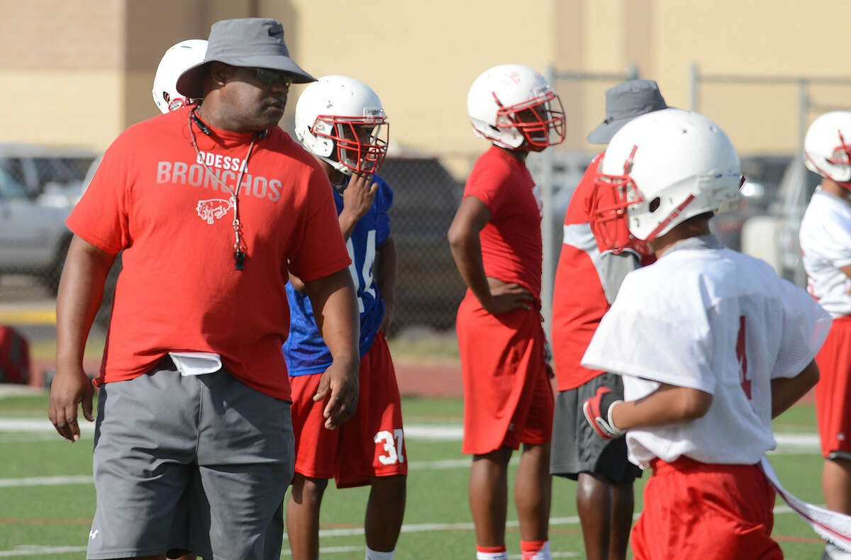 Odessa High's first-year Head Football Coach Danny Servance keeps a watchful eye on things during the first day of football practice Monday at Coleman Field.