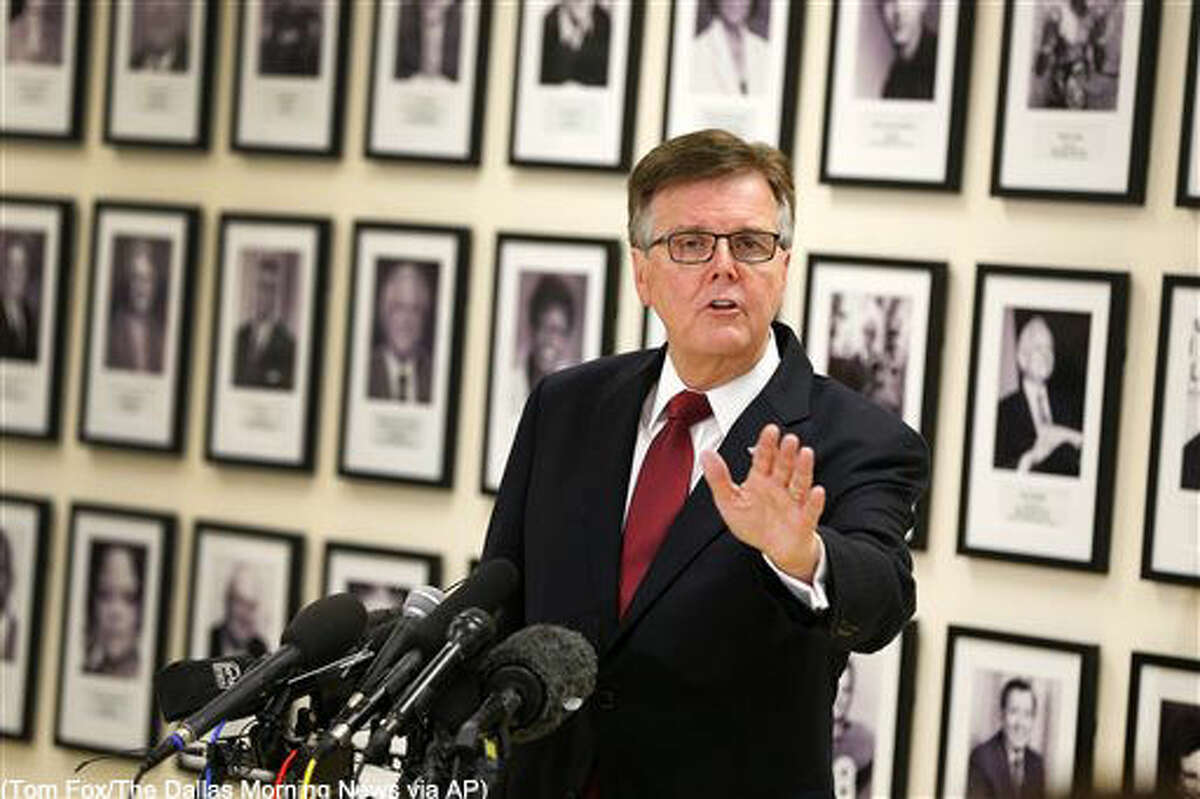 In this photo taken Tuesday, May 10, 2016, Texas Lt. Gov. Dan Patrick, standing in front of the Fort Worth ISD Legacy of Excellence wall, addresses the media on Fort Worth Superintendent Kent Scribner's policy to allow transgender students comfortable access to bathrooms at the FWISD Board of Education complex in Fort Worth, Texas. Scribner announced rules last month allowing transgender students access to single-stall restrooms. Patrick called for the Scribner's resignation. (Tom Fox/The Dallas Morning News via AP) MANDATORY CREDIT; MAGS OUT; TV OUT; INTERNET USE BY AP MEMBERS ONLY; NO SALES
