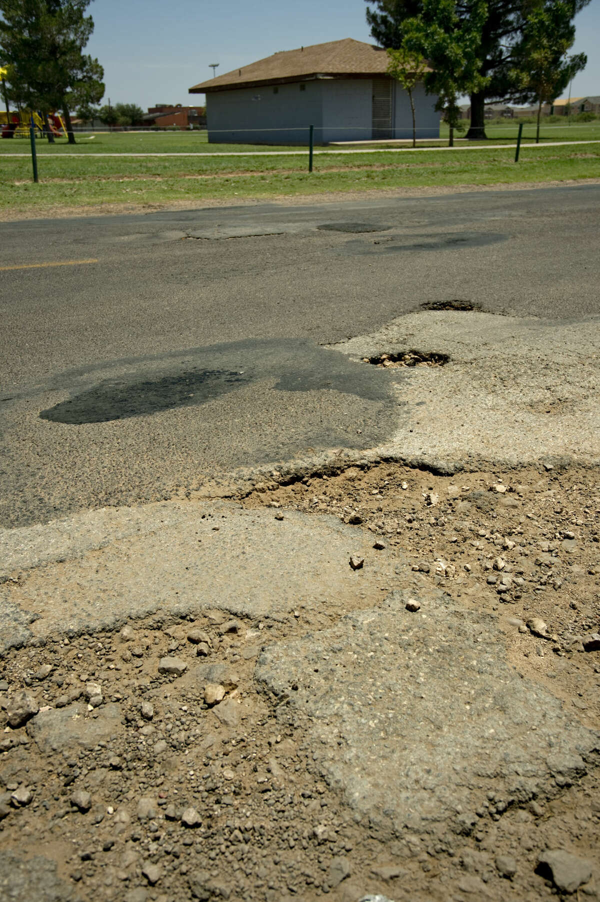 Streets in need of repair or resurfacing around Midland seen Tuesday 06-14-16, like this intersection near Gist and S. Terrell. Tim Fischer\Reporter-Telegram