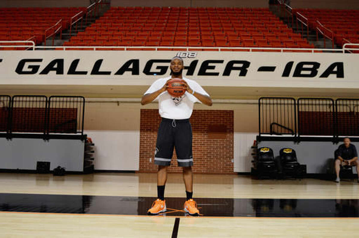 Oklahoma State basketball player Tyrek Coger poses July 6, 2016, in the gym at Gallagher-Iba arena in Stillwater, Okla. Coger died after a 40-minute team workout on the football stadium stairs in hot weather, Thursday, July 21, 2016. (Jimmy Gillispie/Stillwater News Press photo via AP)