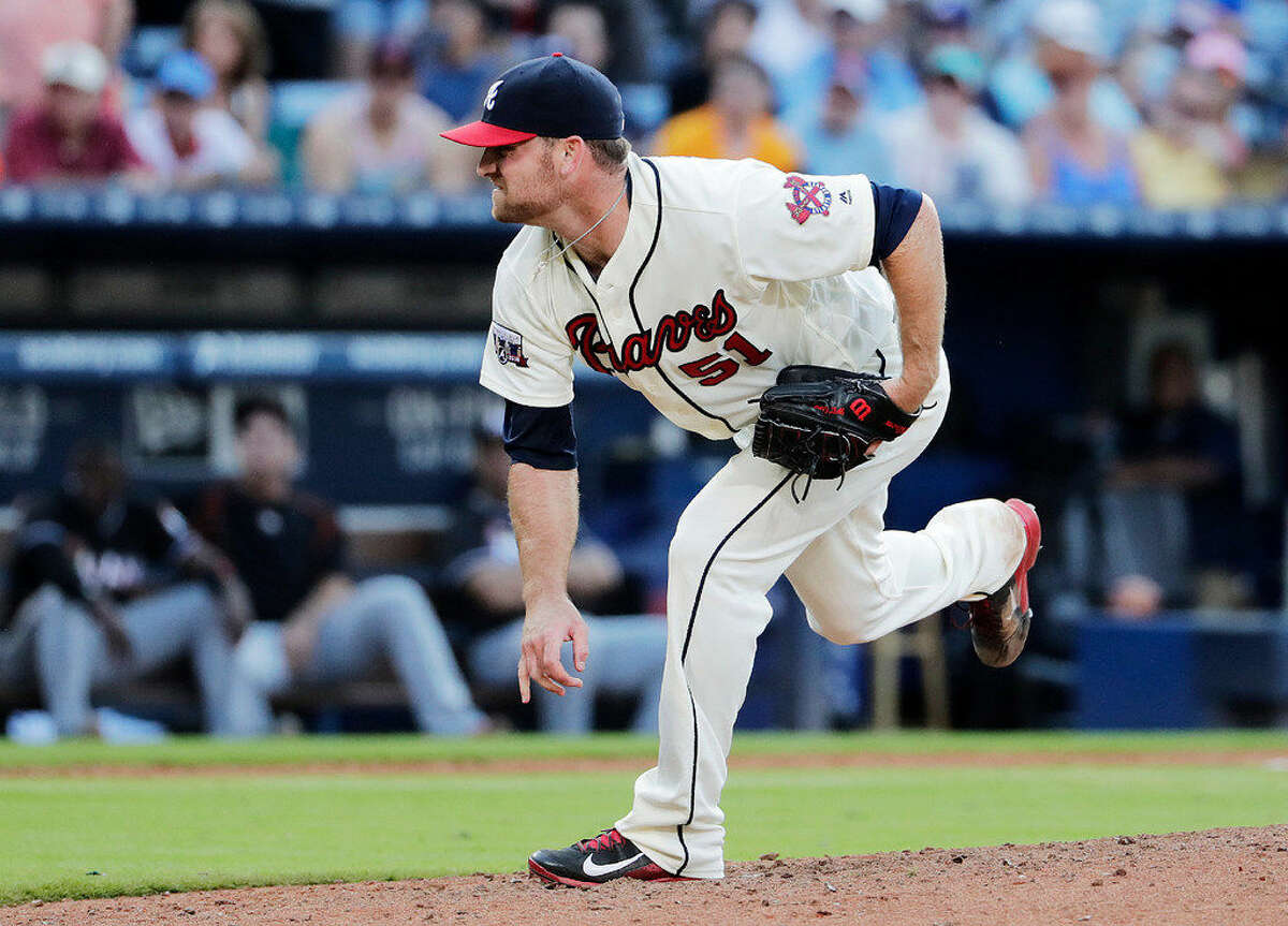 Atlanta Braves relief pitcher Chris Withrow throws in the ninth inning of a baseball game against the Miami Marlins Saturday, May 28, 2016, in Atlanta. (AP Photo/David Goldman)