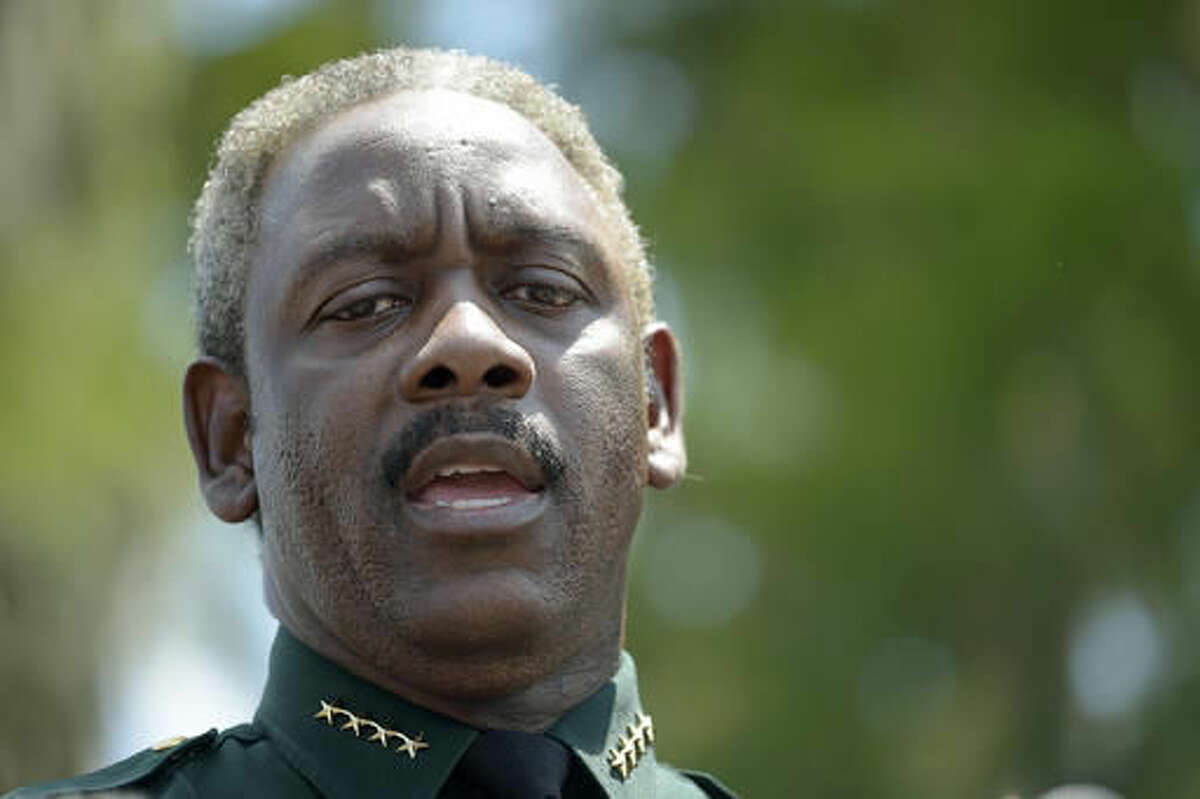 Orange County Sheriff Jerry Demings speaks to reporters during a news conference Wednesday, June 15, 2016, in Lake Buena Vista, Fla., after a toddler was dragged into the lake by an alligator Tuesday evening outside Disney's Grand Floridian Resort & Spa. (AP Photo/Phelan M. Ebenhack)