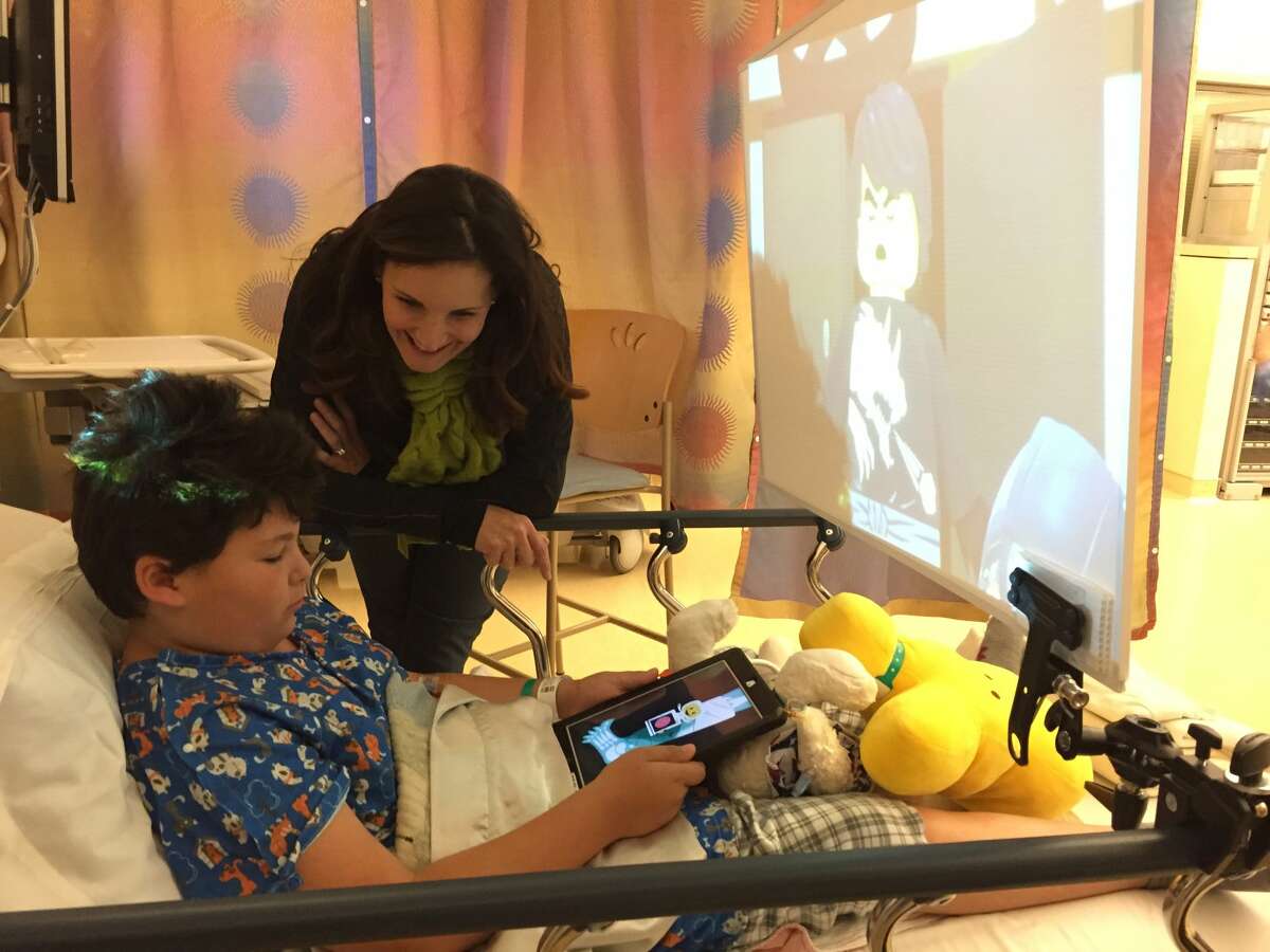A patient at the Lucile Packard Children’s Hospital Stanford uses BERT  -- bedside entertainment theater -- which was developed by Drs. Sam Rodriguez and Thomas Caruso, anesthesiologists at the hospital.