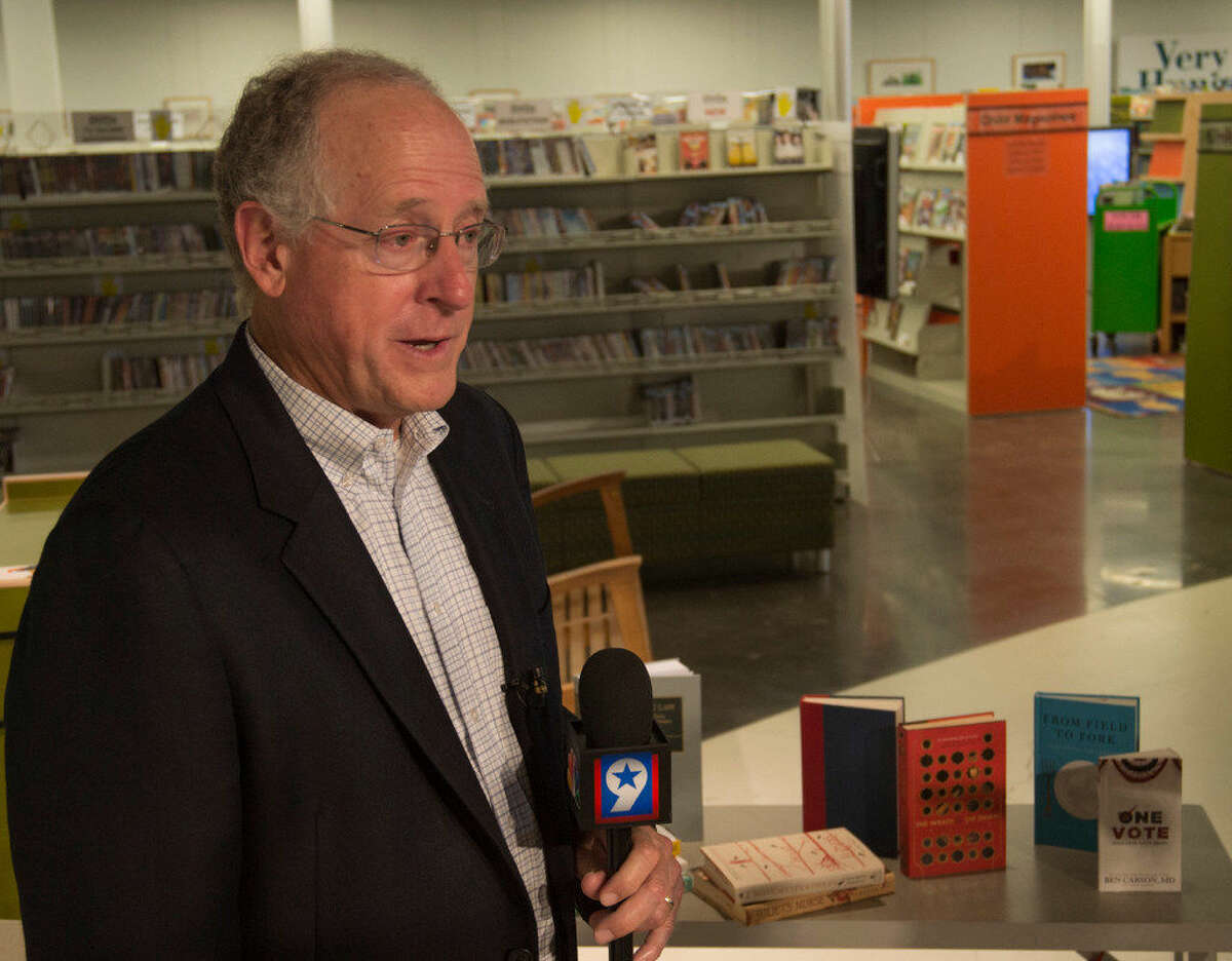 U.S. Rep Mike Conaway speaks Monday 08-22-16 at the Centennial Branch of the Midland County Public Library about some of the books he brought back from the Library of Congress as part of the Surplus Book Program where books are distributed to area libraries from the Library of Congress. Tim Fischer/Reporter-Tel­egram
