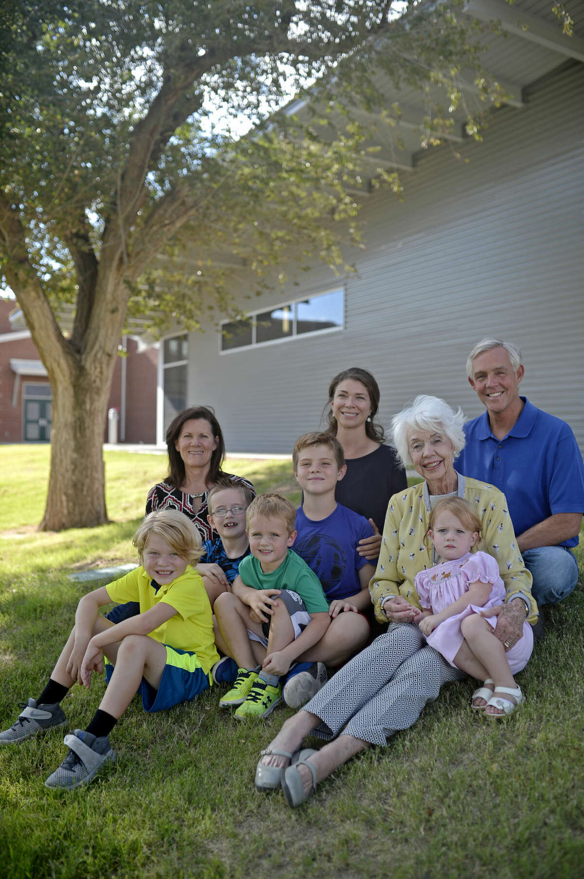Wes Perry (far right) and wife Roni (far left) sit with mother Ricki Perry, and the children and grandchildren, totaling four generations of Midlanders with a connection to Bowie Fine Arts Academy and Midland schools. Photographed Friday, Sept. 23, 2016 at Bowie Fine Arts Academy.James Durbin/Reporter-Telegram