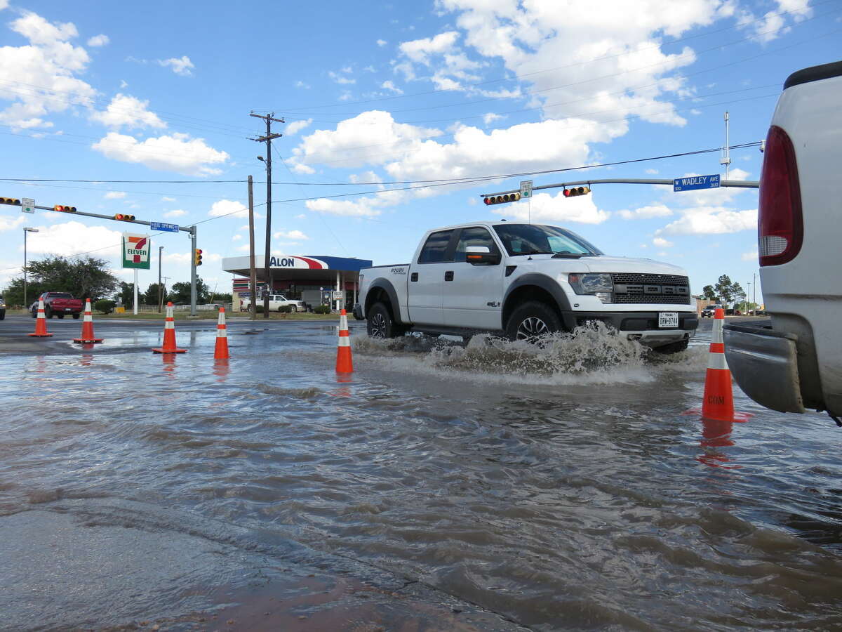 Intersection of Big Spring Street and Wadley Avenue is flooded Friday after a water line leak or break.