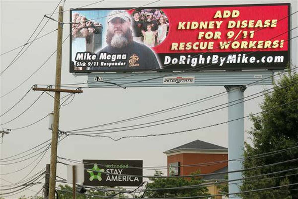 This Thursday, June 23, 2016 photo shows a billboard rented by Mike Megna, that includes Megna's name and picture as well as a plea asking for kidney disease to be added to the list of covered conditions by a fund to help Ground Zero workers with health problems. The New Jersey man who spent three weeks looking for survivors in the days after the 9/11 attacks is using billboards in a push to have his kidney disease, which he believes was caused by dust from the rubble of the fallen World Trade Center towers, added to the list of covered conditions. (Aristide Economopoulos/NJ Advance Media via AP)