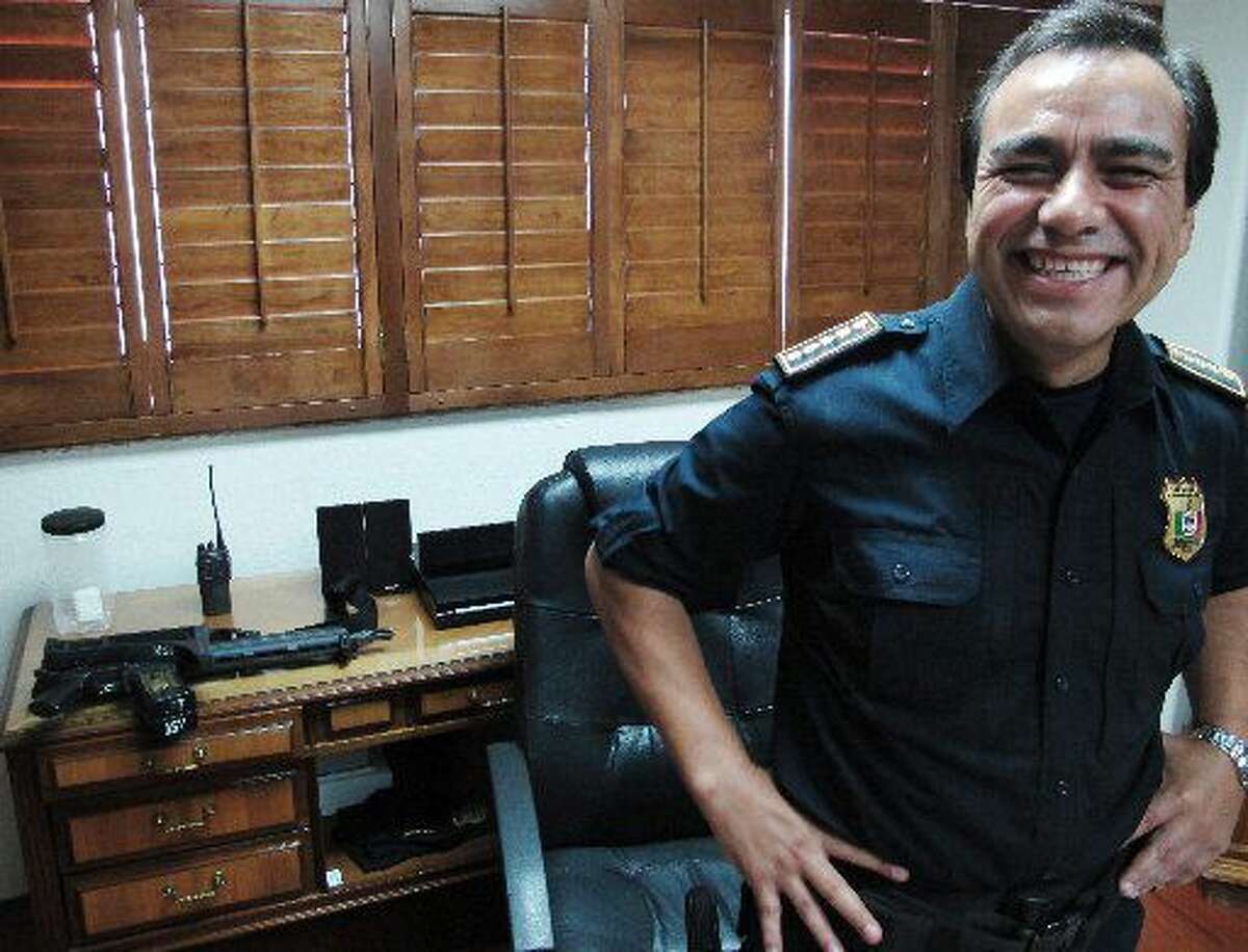 Julian Leyzaola, police chief of Juarez, smiles during an interview with foreign media in his office in Juarez, Mexico, Tuesday June 7, 2011. The new police chief in Mexico's deadliest city says bringing crime down and cleaning up the police force should be much easier than it was in Tijuana, where he spent three years as the top cop. (AP Photo/Juan Carlos Llorca)